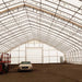 TMG Industrial Pro Series 70' x 100' Dual Truss Storage Shelter with Heavy Duty 32 oz PVC Cover & Drive Through Doors, TMG-DT70100-PRO
